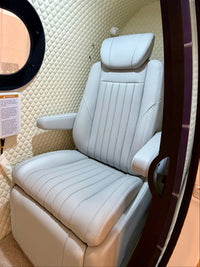 Side entry chamber with A/C, leather reclining chairs, TV and optional desk.  